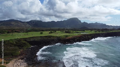 Aerial shot of golf course by the beach