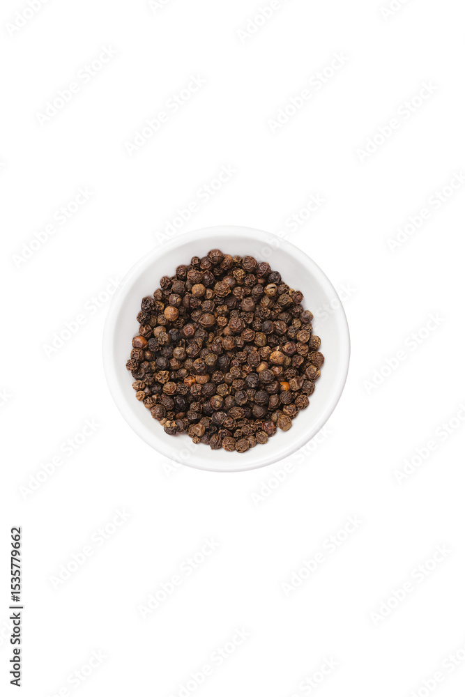Black peppercorn in white bowl isolated Black peppercorn in white bowl isolated
