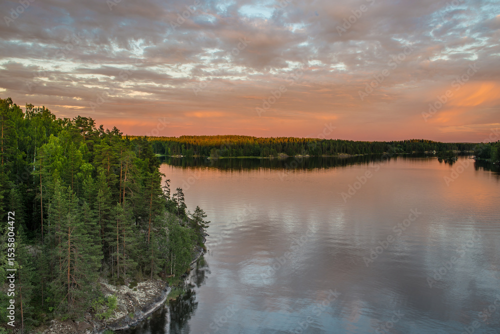 Obraz premium Sunset over the lake Saimaa in Rauha district, Finland.