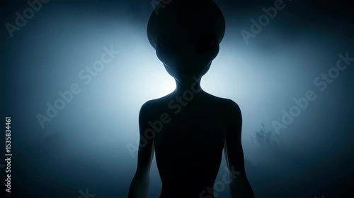 Alien silhouette in thick fog with bright white light behind it, horror concept and ufo science fiction scene footage