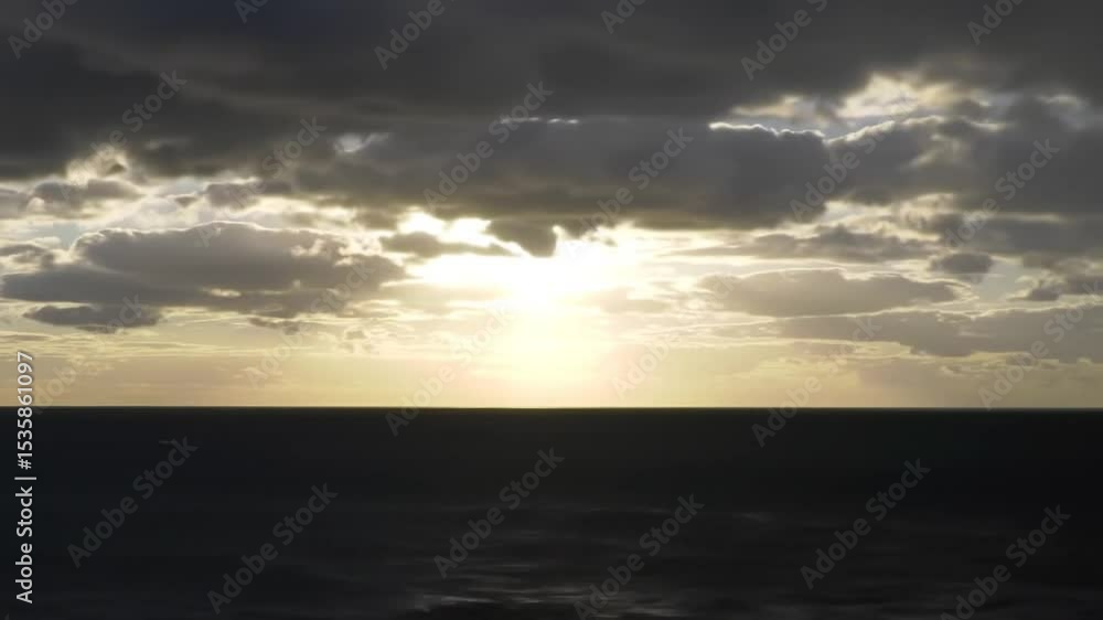 Golden Horizon With Moody Sky And Tranquil Ocean Surface Golden Horizon With Moody Sky And Tranquil Ocean Surface