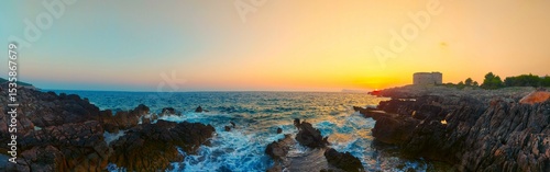 Panorama of a colorful sunset at the shore of Arza fortress