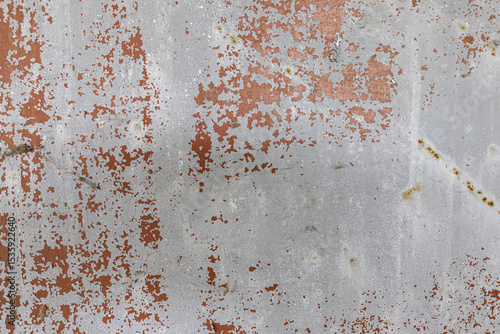 Konstfotografi Aged metal surface with peeling paint and rust patches forming abstract weathere