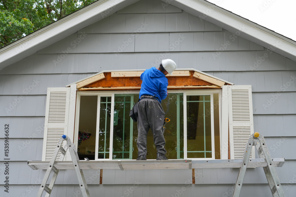 Fototapeta premium contractor working on replacing the window of the house