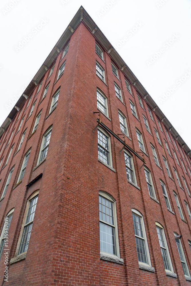 Fototapeta premium low angle view on old building with brick wall