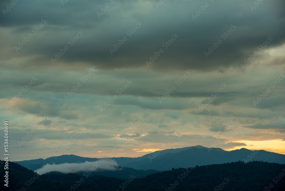 Fototapeta premium Beautiful Mountain landscape foggy windy mountain range green landscape asian farm. Amazing Landscape mountain green field meadow white cloud blue sky on sunrise. Countryside sunlight heaven scenery