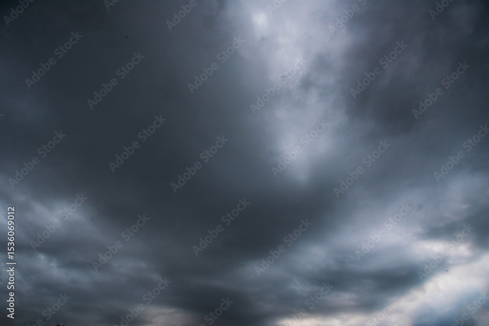 Dramatic dark storm thundercloud rain clouds on black sky background. Dark thunderstorm clouds rainny landscape. Meteorology danger windstorm disaster climate. Dark cloudscape storm disaster gray sky Dramatic dark storm thundercloud rain clouds on black sky background. Dark thunderstorm clouds rainny landscape. Meteorology danger windstorm disaster climate. Dark cloudscape storm disaster gray sky