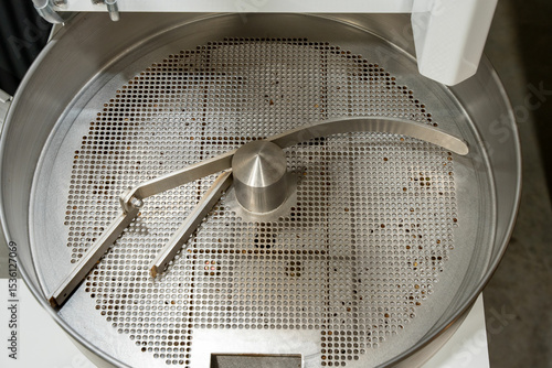 Empty commercial coffee roaster cooling bin.
