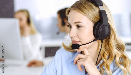 Thoughtful customer service agent with headset. Focused listening and support in a modern call center environment. Business communication.