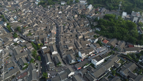 Drone views of Dongqian Lake, farmland, old town rooftops, and mountain sunset near Ningbo, China. Scenic countryside and waterfront scenes from above.