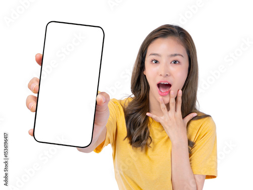 Surprised Asian woman holding and showing blank smartphone screen in hand, amazed facial expression, isolated on a transparent background, Mockup mobile display with copy space for app or website