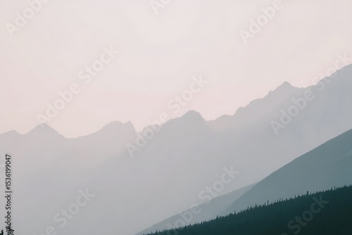 Smoky mountain ranges with coniferous forest