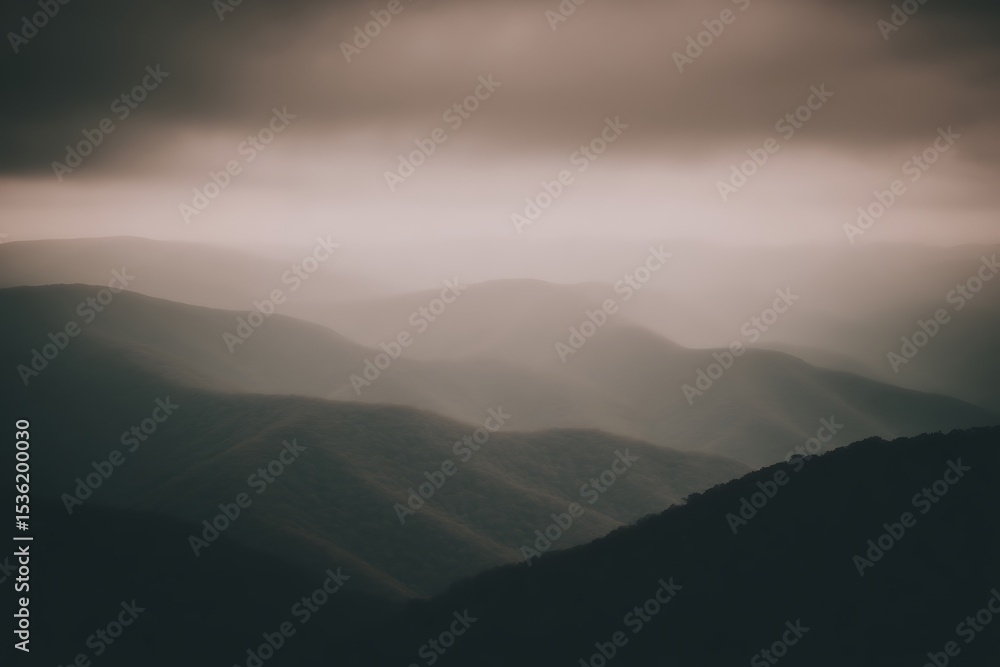 Misty mountains shrouded in muted light Misty mountains shrouded in muted light