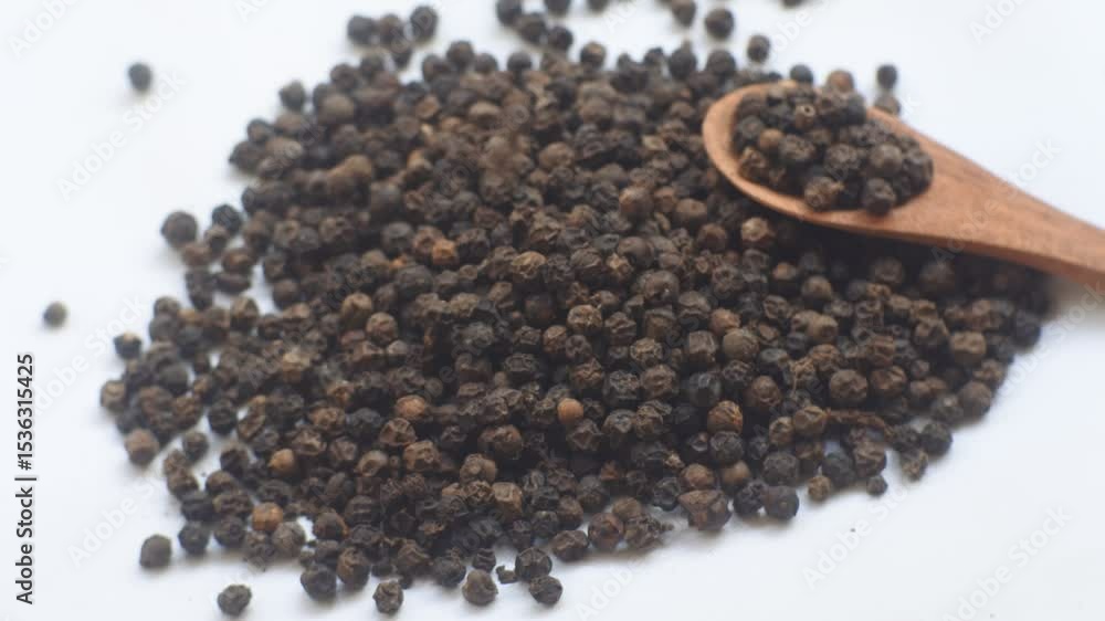 black pepper seeds on white background black pepper seeds on white background