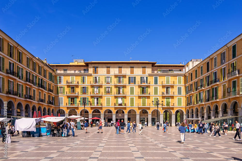 Naklejka premium View at Plaza mayor de palma de mallorca with tourist a sunny summer day