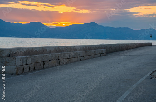An asphalt road running through the beautiful coastal landscapes of the Croatian island of Brac