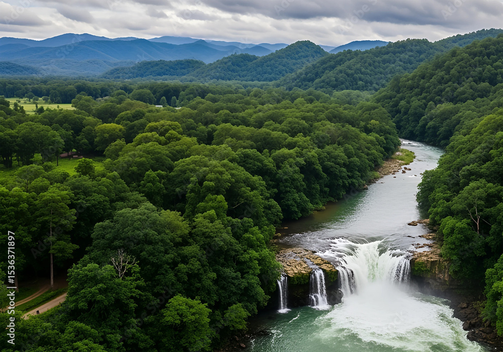 Fototapeta premium Lush Green Forests Surround A Powerful Waterfall Cascading Over Rocks Into A River Set Against A Backdrop Of Rolling Blue Hills And Dramatic Skies