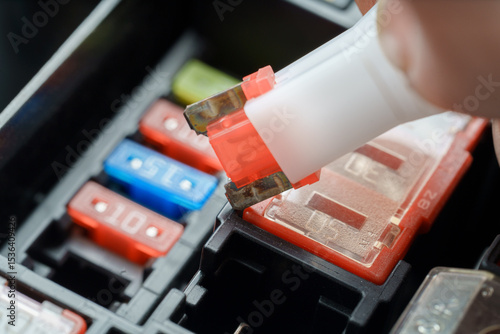 Hand Removing Blown Automotive Fuse