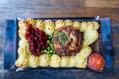Stockholm, Sweden A  traditional dish of hashed beef with mashed potatoes on a wooden platter, known as plankstek.