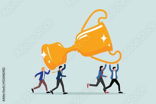 Team achievement, teamwork collaborating working together to achieve a business goal, winning an award or success, people in a business team celebrating helping to carry a big winner's trophy.