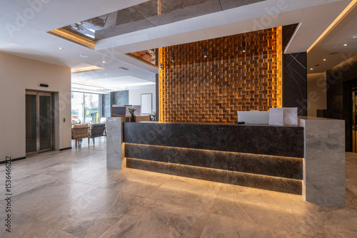 Modern hotel reception with wooden wall