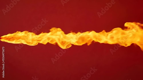 Fiery flame burst with bright orange and yellow colors on red background showing intense heat and energy
