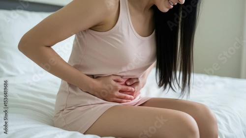 Woman holding stomach suffering from abdominal cramps or indigestion pain