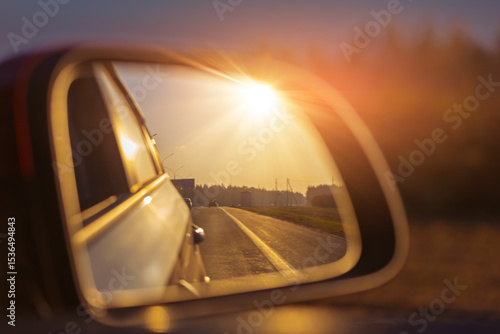 Konstfotografi The sun is reflected in the mirror, evening road