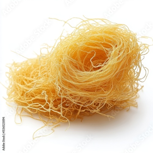 Golden curly kadaif (angel hair pastry) on a white background 