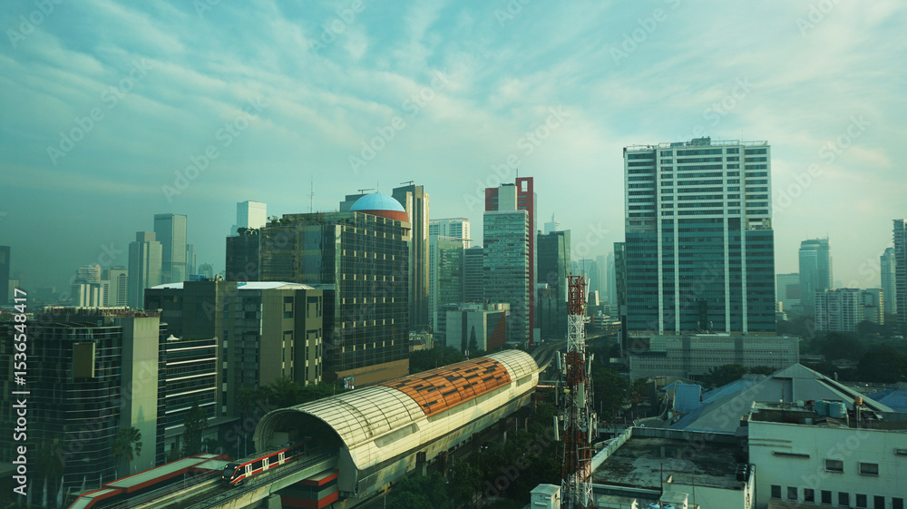 Fototapeta premium modern urban skyline the essence of modern Jakarta is dominated by high rise buildings and skyscrapers, public transportation system Jakarta MRT (Mass Rapid Transit)