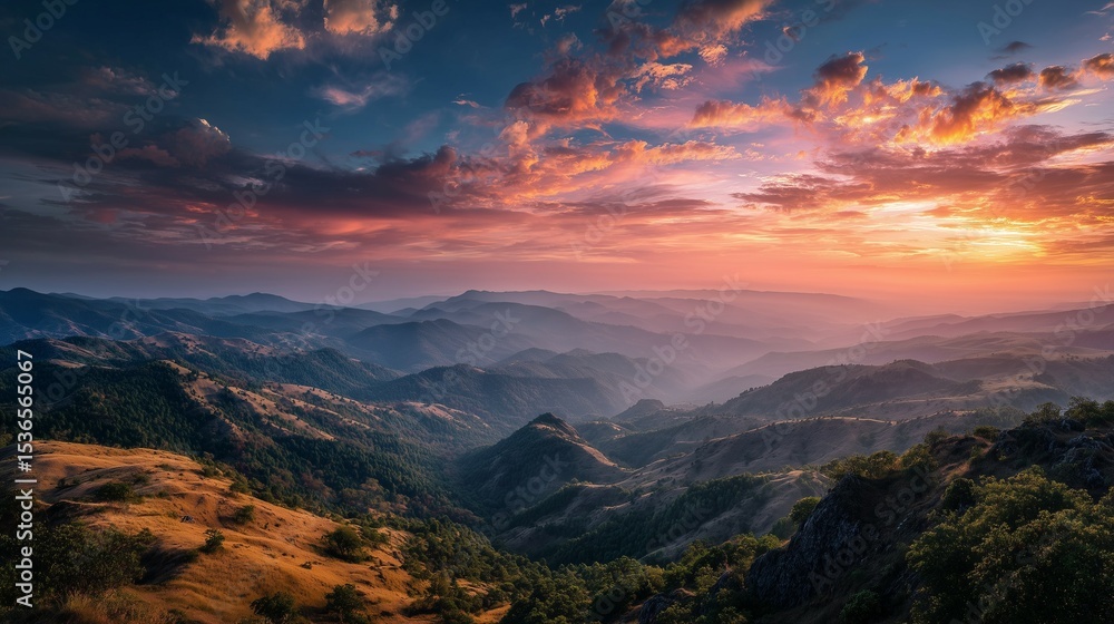 Fototapeta premium Golden Sunrise Over Rolling Mountains