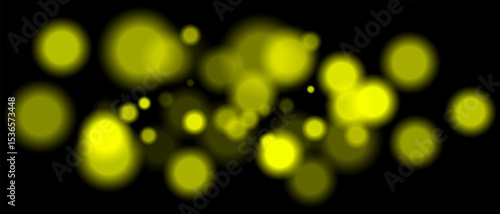 Yellow blurred bokeh particles with varying size and opacity on black background. Abstract design element for festive or sci-fi scenes.