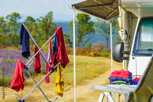 Wallpaper Mural Clothes hanging to dry outdoors by camping car. Caravan vacation. Torontodigital.ca