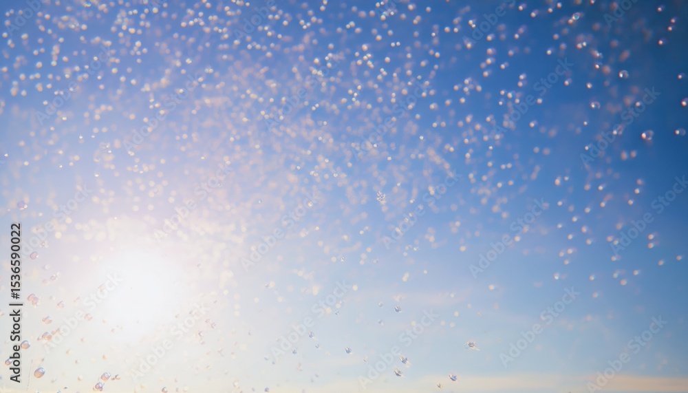 Obraz premium sunlit soap bubbles floating against clear blue sky with soft sunlight flare and dreamy bokeh effect, ideal for web design, background texture, print media, or creative branding visual
