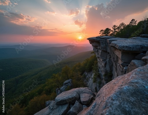 Scenic Hawksbill Crag Whitaker Point at sunset in Newton County Arkansas. Pink sunset light over green forest, rocky cliff. Popular travel spot, breathtaking landscape, ideal nature tour.