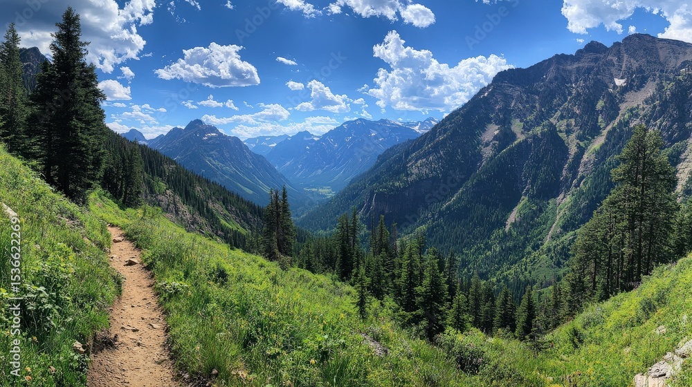 Fototapeta premium A scenic mountain landscape with green trees and blue skies