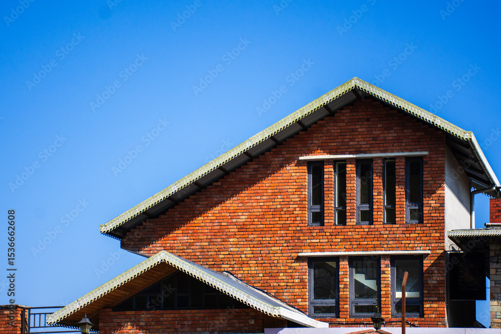 Modern Brick House Design Against a Clear Blue Sky Modern Brick House Design Against a Clear Blue Sky