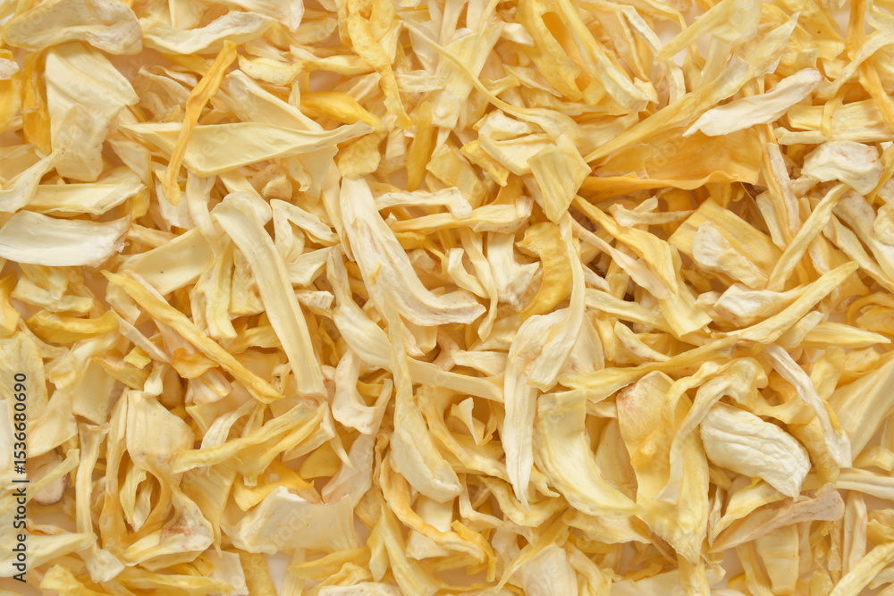 Fototapeta premium Organic Dried Jackfruit Slices on White Background. High-resolution image of organic dried jackfruit slices in a bowl, with scattered pieces on a clean white background.