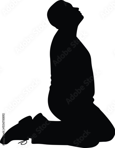 Silhouette of a kneeling person in prayer or meditation, representing spirituality and inner peace

