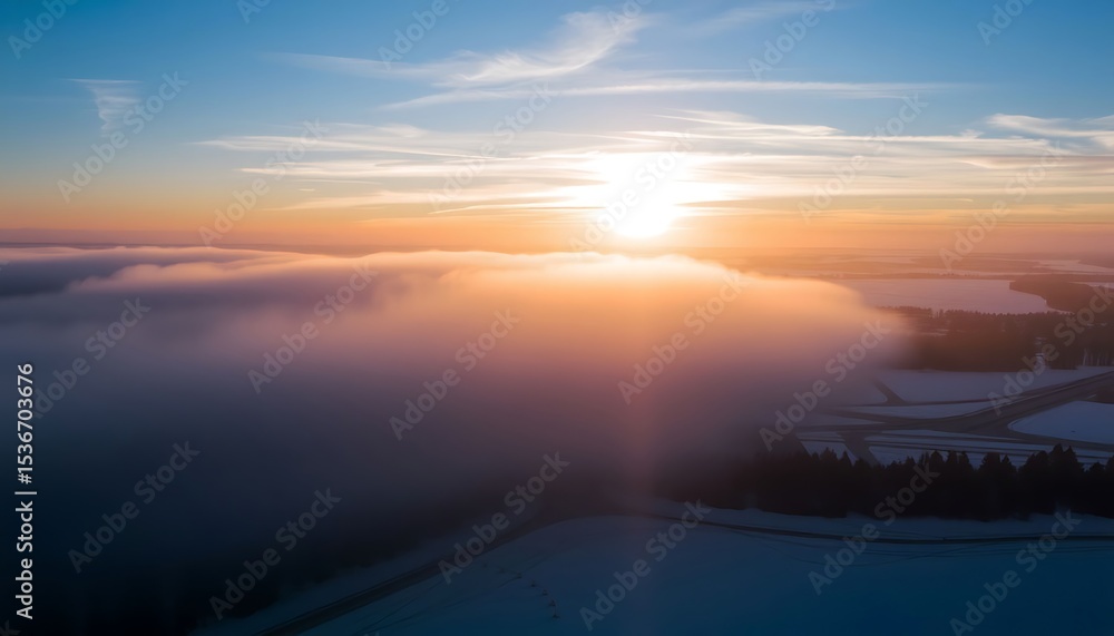 Fototapeta premium Sunrise Over the Clouds: Aerial view of a stunning sunrise over the clouds, with the sun shining brightly and the clouds lit up with colors. 