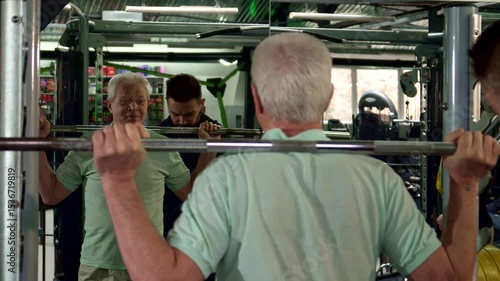 Senior man trains at the gym with focused determination