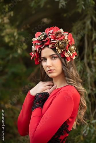 A brunette woman with a flower headdress, portrait in nature