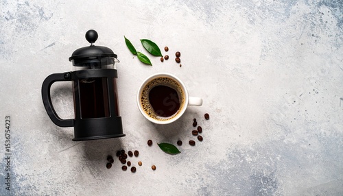 Inviting flat lay of coffee pot and cup of fresh brewed coffee on concrete surface display