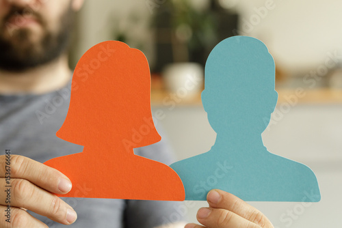 Person holds paper silhouet...