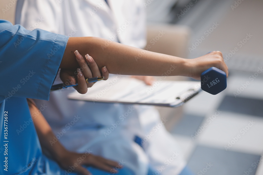 Fototapeta premium Unrecognizable uses blue hand weight during physical therapy session