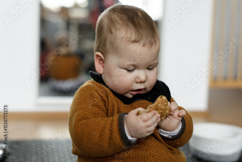 Adorable baby enjoys a whol...