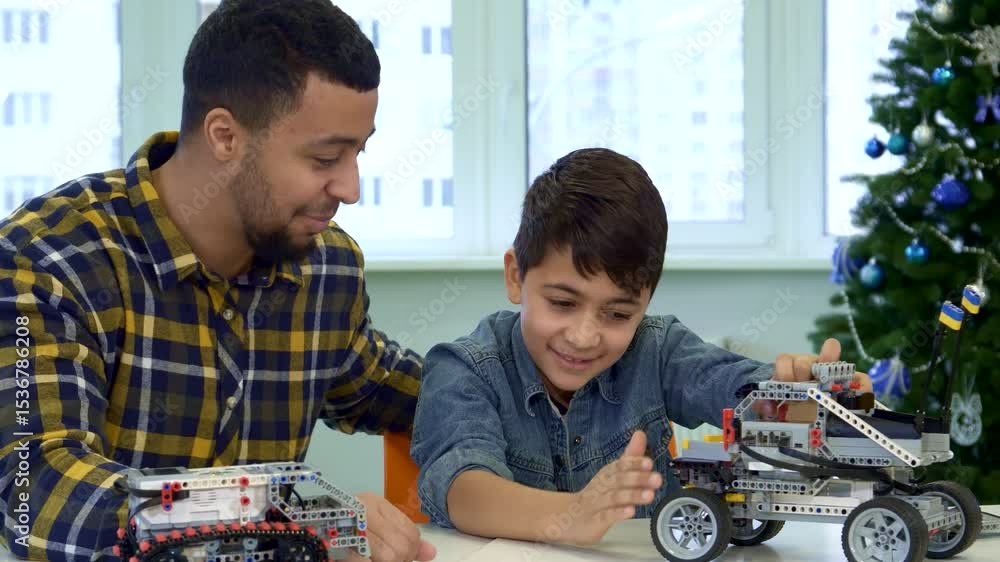Joyful father and son bonding over toy SUV playtime Joyful father and son bonding over toy SUV playtime