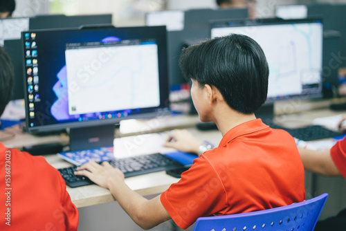 Defocused  Student study in class computer technology at the elementary school. Education concept.