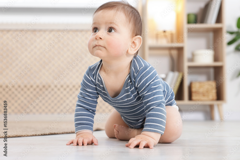 Cute little baby crawling on floor at home Cute little baby crawling on floor at home