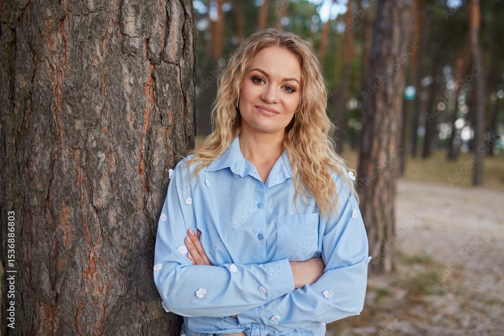 Confident Woman with Arms Crossed by Tree Confident Woman with Arms Crossed by Tree